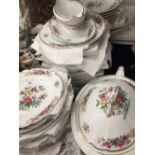 A Limoges floral decorated extensive dinner service