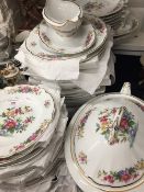 A Limoges floral decorated extensive dinner service