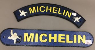 Two cast iron Michelin signs