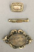 A gold cased Memorial brooch with hair worked pane, uninscribed,