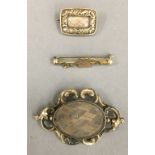 A gold cased Memorial brooch with hair worked pane, uninscribed,