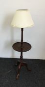 A 20th century mahogany standard lamp table