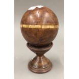 A treen ball with bone inlay and a Davilos toy