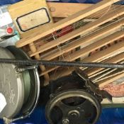 A quantity of fishing reels, etc.