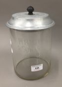 A vintage Wright and Son glass biscuit jar with aluminium lid