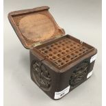 An Eastern carved wooden cigarette box