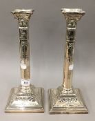 A pair of silver plated candle sticks