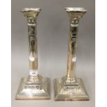 A pair of silver plated candle sticks