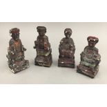 A set of four small Chinese wooden figures