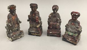 A set of four small Chinese wooden figures