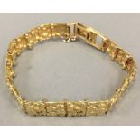 An 18 K gold nugget bracelet (29.