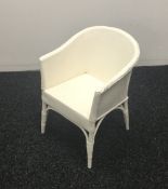 A Lloyd Loom style musical child's chair