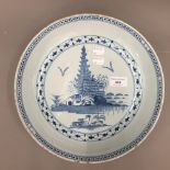 A finely painted blue and white 18th century English Delft deep sided dish