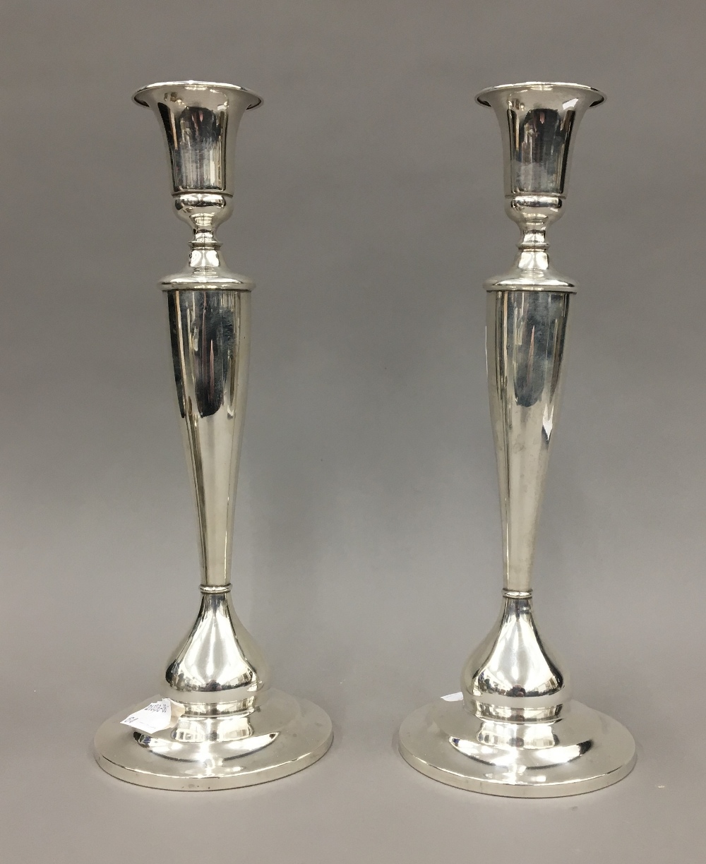 A pair of sterling silver candlesticks