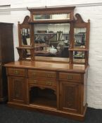 A Victorian carved oak mirror back sideboard