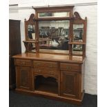 A Victorian carved oak mirror back sideboard