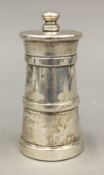 A silver pepper mill