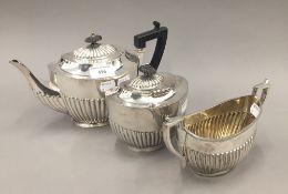 A three piece silver plated tea set