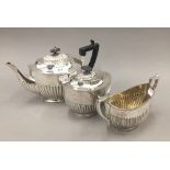 A three piece silver plated tea set