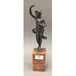 A silvered bronze model of a scantily clad woman