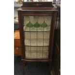 An Edwardian lead glazed mahogany display cabinet