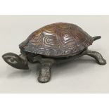 A novelty tortoise form desk bell - WITHDRAWN