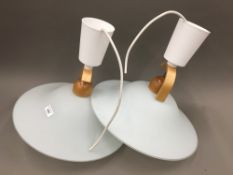 A pair of modernist ceiling lights