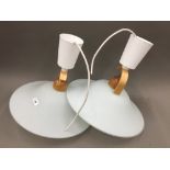 A pair of modernist ceiling lights