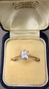 An 18 ct gold diamond solitaire ring,