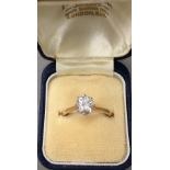 An 18 ct gold diamond solitaire ring,