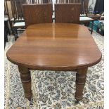 A Victorian two leaf oak extending dining table