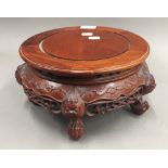 A Chinese carved hardwood stand