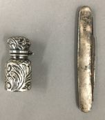 A small silver perfume bottle,