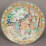 A large Chinese porcelain charger, well painted with a scholarly figure,