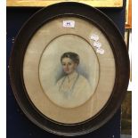 A Victorian portrait watercolour of a young lady, in an oval frame,
