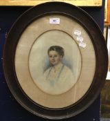 A Victorian portrait watercolour of a young lady, in an oval frame,