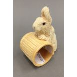 A bone rabbit napkin ring