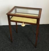 A Victorian inlaid mahogany bijouterie table