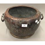 A Japanese florally decorated twin handled copper censer