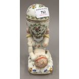 A porcelain cherub egg box