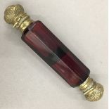 A Victorian ruby glass double ended scent bottle