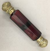 A Victorian ruby glass double ended scent bottle