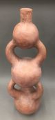 An African triple gourd terracotta vase