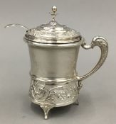 An 800 silver lidded mustard with glass liner and 800 silver spoon en-suite (107 grammes total