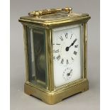 A late 19th/early 20th century brass cased carriage alarm clock