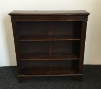 An early 20th century oak open bookcase