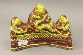 A Chinese dragon form brush rest