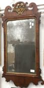 A George III walnut scroll framed mirror,