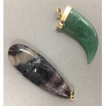 A blue john pendant and a jade pendant