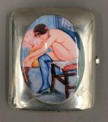 A silver cigarette case depicting a nude